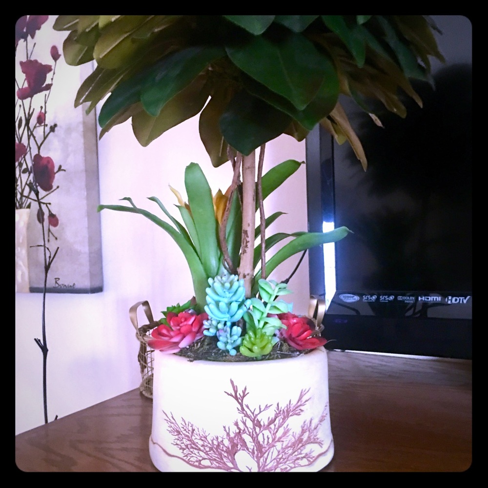 Artificial succulent tree flower arrangement.